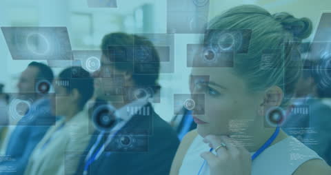 Business Professionals Engaging with Futuristic Interfaces