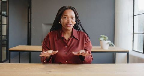 Businesswoman Explaining Ideas in Modern Office Setting