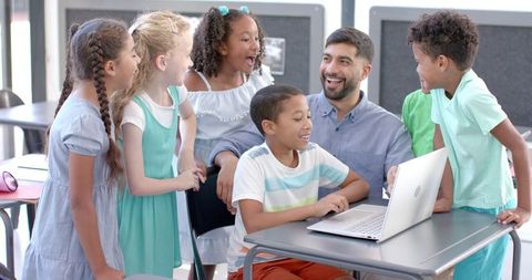 Smiling Teacher and Engaged Multiethnic Students in Modern Classroom - Download Free Stock Images Pikwizard.com