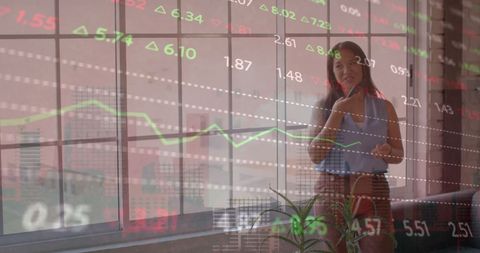 Businesswoman Analyzing Stock Market Trends in Office - Download Free Stock Images Pikwizard.com