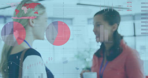 Businesswomen Analyzing Data in Office Environment