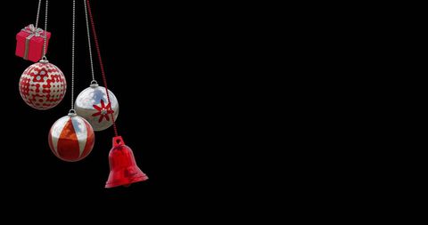 Festive Red Christmas Ornaments Hanging on Black Background