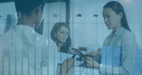 Multiracial Business Team Analyzing Graph Data in Modern Office