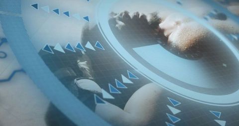 Reclining male undergoing biometric scanning with circular HUD grid, data arrows and sensor overlay