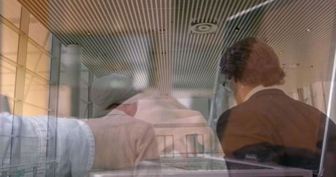 Business Professionals Collaborating with Modern Technology