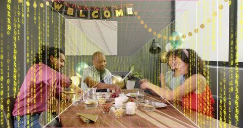 Modern office team collaborating around festive meeting table with laptops, tablet, welcome banner