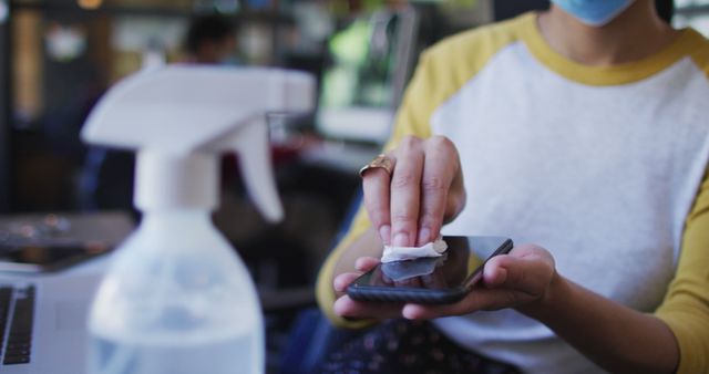 Person Sanitizing Smartphone in Modern Office - Download Free Stock Images Pikwizard.com