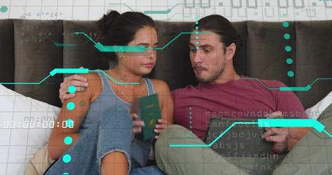 Couple reviewing travel documents on bed with futuristic holographic interface and tablet