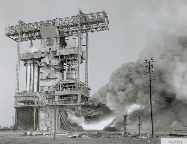 This iconic scene captures the dramatic moment of the F-1 engine test firing at the Marshall Space Flight Center. What stands out is the intense flame and copious exhaust emerging from the static test stand. The F-1 engines, each providing immense thrust, were critical components of the Saturn V rocket, the towering launch vehicle used in Apollo missions for moon exploration. Historical imagery like this is ideal for educational resources, space history documentaries, engineering studies, and aerospace exhibitions.