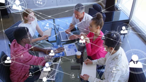 Diverse Business Team Discussing Network Data at Office Table