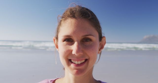 Smiling Young Woman Relaxing on Sunny Beach - Download Free Stock Images Pikwizard.com