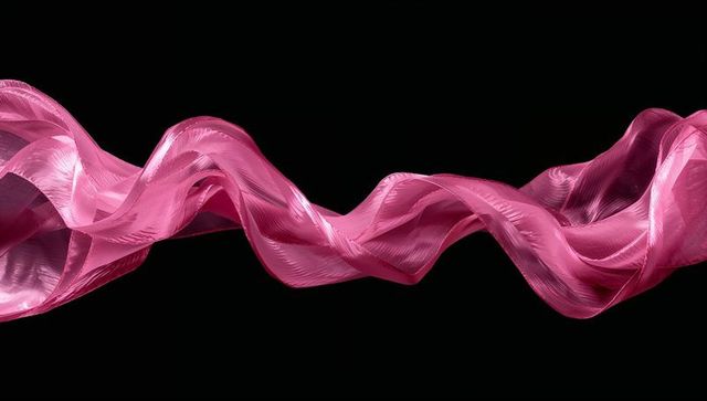 Flowing Pink Ribbon in Dark Abstract Space