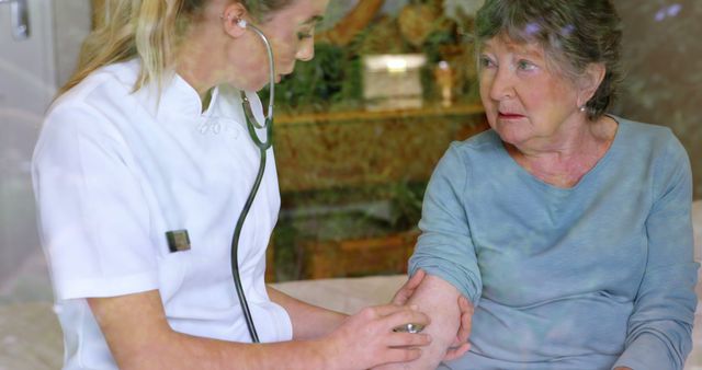 Female Nurse Taking Blood Pressure of Senior Woman at Home - Download Free Stock Images Pikwizard.com