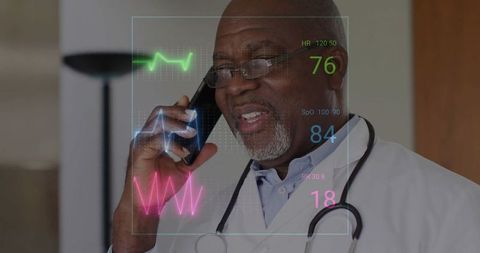 Senior doctor using smartphone with futuristic vital signs overlay