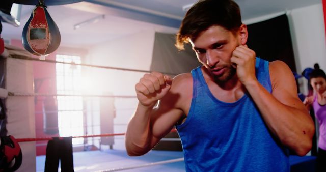 Man Training in Boxing Gym with Intense Expression - Download Free Stock Images Pikwizard.com