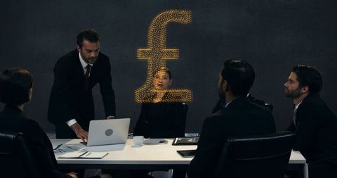 Diverse team discussing financial growth in business meeting