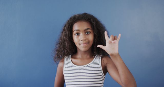 Young Girl Using American Sign Language 'I Love You' Gesture - Download Free Stock Images Pikwizard.com