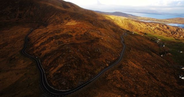 Winding Mountain Road Underneath Setting Sun - Download Free Stock Images Pikwizard.com