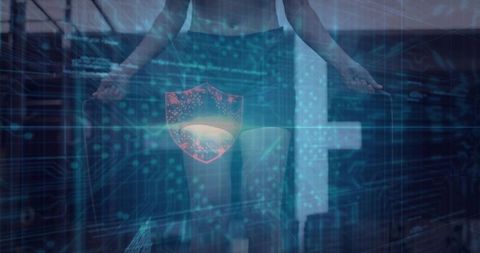 Mid-adult woman standing in tech studio wearing sports bra and shorts with holographic pelvic shield