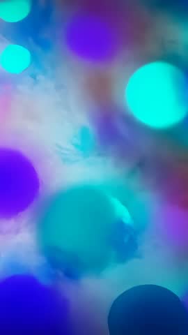 Vertical abstract bokeh video shifting teal and purple light blobs loopable backgrounds