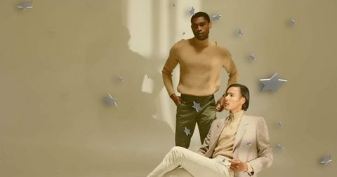 Male fashion models in studio with metallic star decor