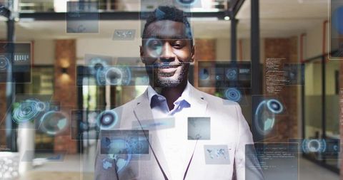 Business leader interacting with holographic data displays in modern corporate atrium