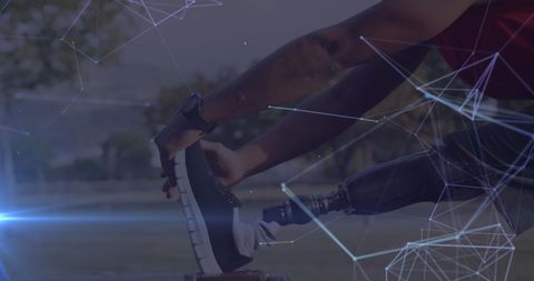 Male Athlete with Prosthetic Leg Stretching Outdoors, Technology Overlay