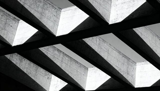 Concrete Ribs Casting Sharp Triangular Shadows over Parking Garage Roof