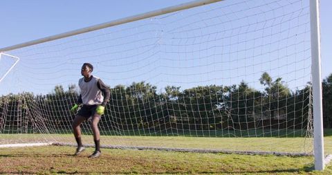 Goalkeeper Ready for Challenge on Sunny Day