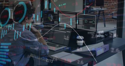 Businessman Analyzing Financial Data on Multiple Screens