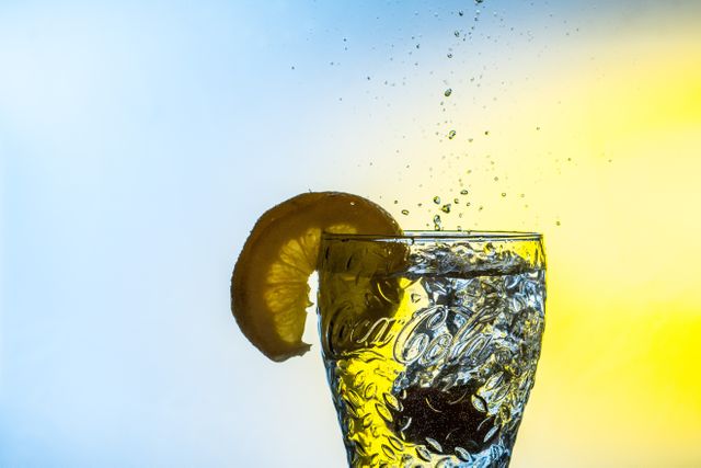 Refreshing Lemon Slice Drop Water Splash in Glass - Download Free Stock Photos Pikwizard.com