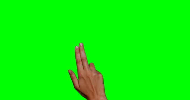 Hand performing a two-finger peace sign. Ideal for projects related to communication, symbols, body language, or gesture recognition. Could be used for instructional content on sign language or visual storytelling. The green screen allows easy isolation and superimposition in various digital contexts.