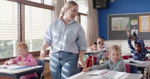 Smiling teacher engaging with students in active learning environment