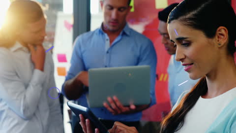 Diverse Team Collaborating with Digital Devices