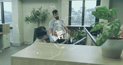 Office team collaboration with digital shopping icons