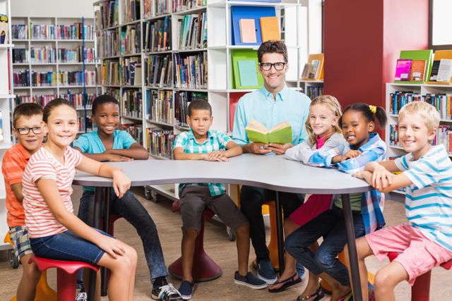 Teacher reading to a diverse group of children in a school library. Ideal for educational materials, school brochures, and websites promoting literacy and learning environments. Can be used to illustrate concepts of diversity, teamwork, and academic engagement.
