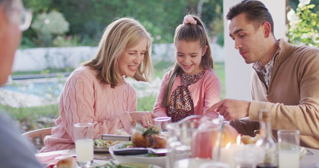 Happy Family Gathering Around Outdoor Dinner Table - Download Free Stock Images Pikwizard.com