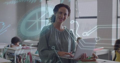 Teacher presenting laptop in tech classroom with digital hud learning overlay
