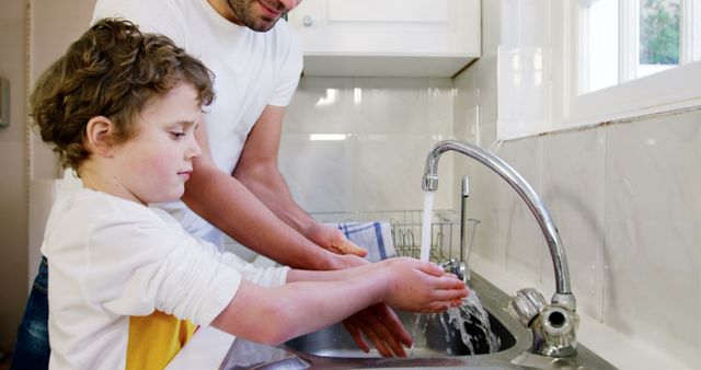 Father Teaching Son to Wash Hands at Kitchen Sink - Download Free Stock Images Pikwizard.com