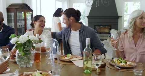 Friends Gathering at Home for Joyful Lunch Experience
