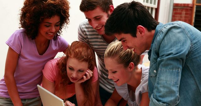 Young Diverse Group Collaborating on Project Using Tablet - Download Free Stock Images Pikwizard.com