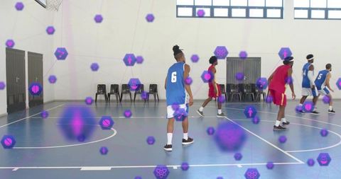 Basketball team using augmented reality overlay and performance analytics on indoor court