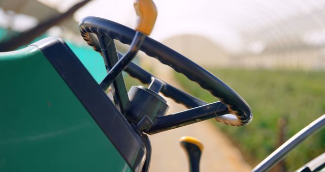 Close-Up of Tractor Steering Wheel in Greenhouse - Download Free Stock Images Pikwizard.com