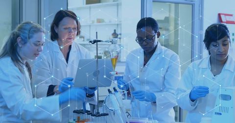 Diverse Scientists Collaborating in High-Tech Laboratory With Digital Network Overlay - Download Free Stock Images Pikwizard.com