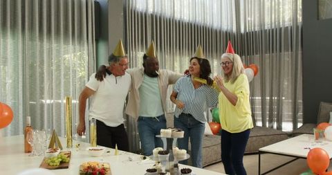 Diverse colleagues celebrating office party with joy and laughter