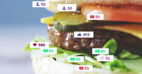 Glistening stacked burger getting social media notifications and engagement icons