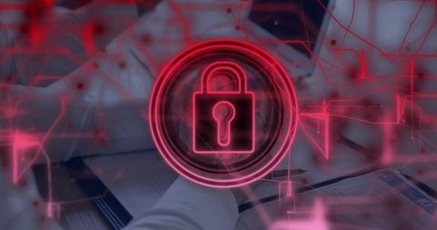 Red digital lock overlay on team reviewing documents for cybersecurity and data protection