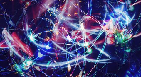 Colorful abstract dynamic light streaks pulsing in dark