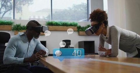 Diverse professionals testing virtual reality collaboration at modern office meeting table