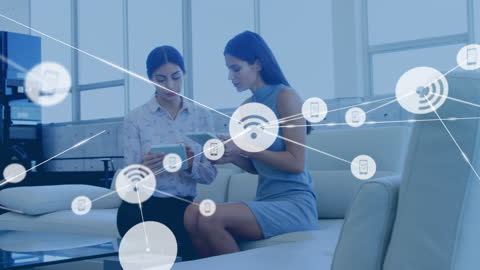 Businesswomen Using Tablets with Virtual Network Overlay